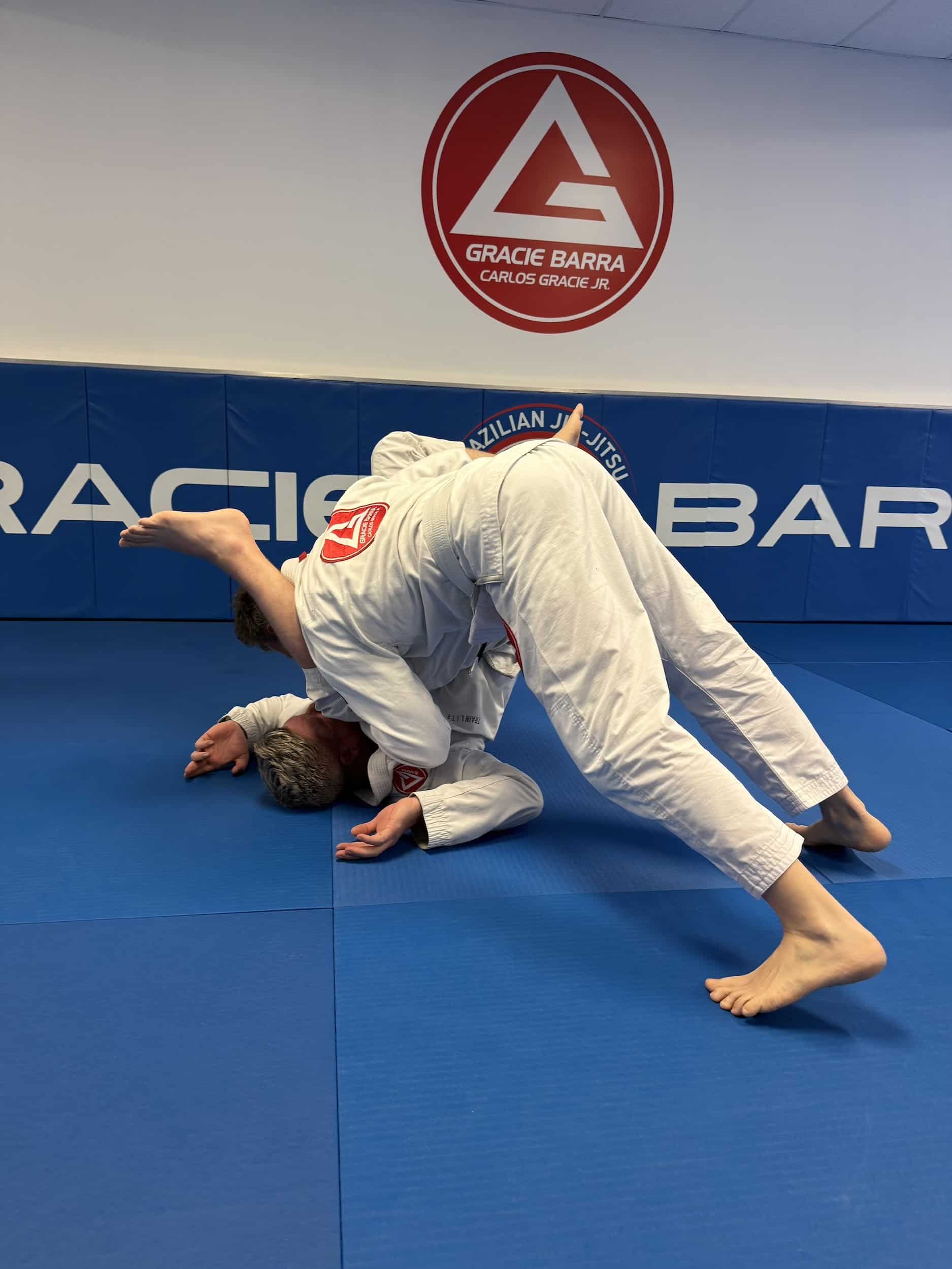 Gracie Barra Anniston students sparring in the middle of bjj class