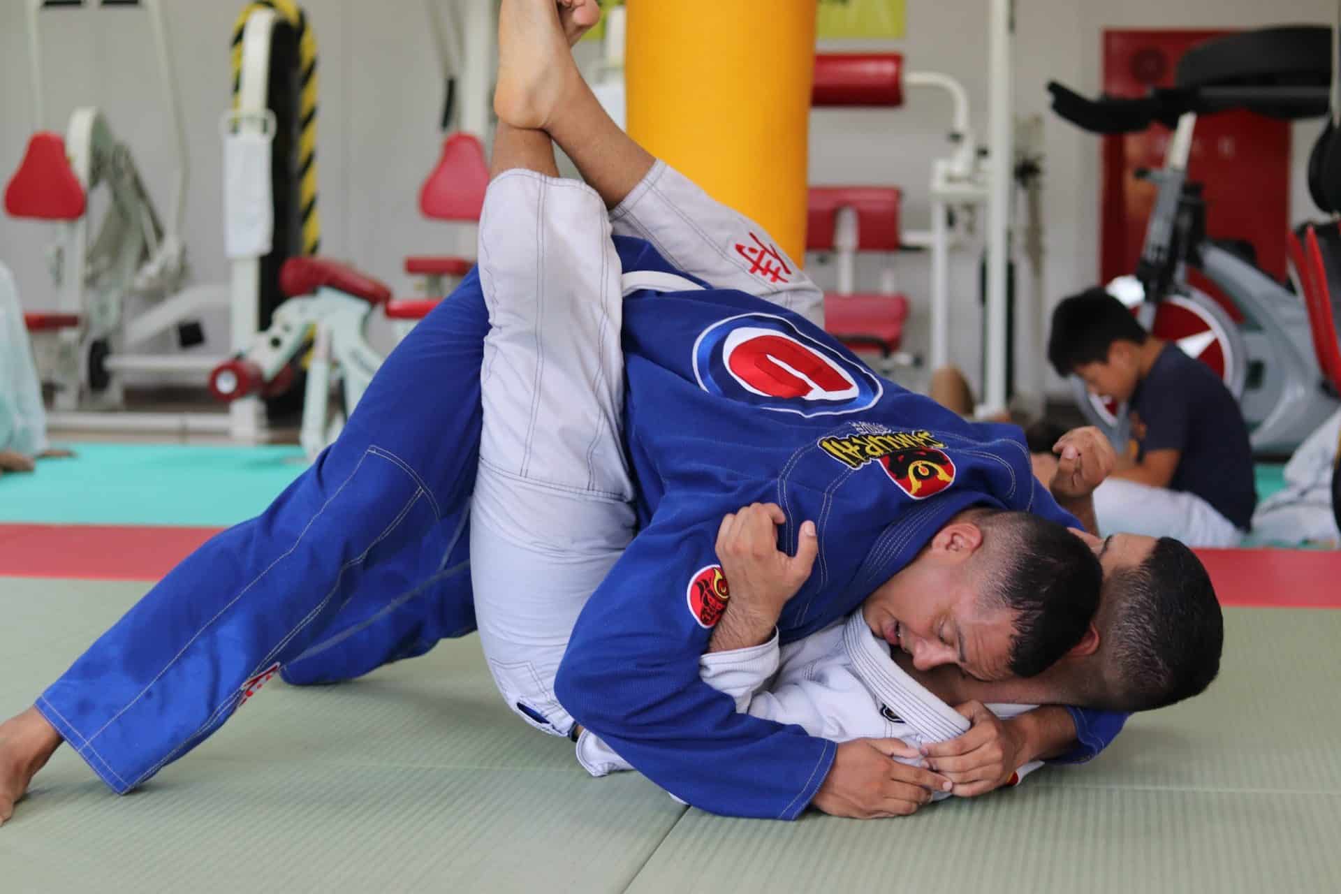 two Gracie Barra Anniston students sparring in brazilian jiu-jitsu class