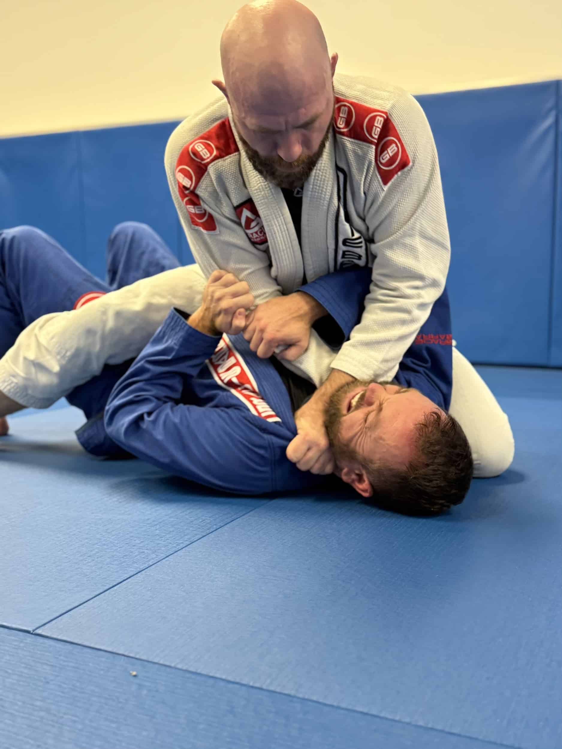 instructor and student sparring for bjj class at Gracie Barra Anniston