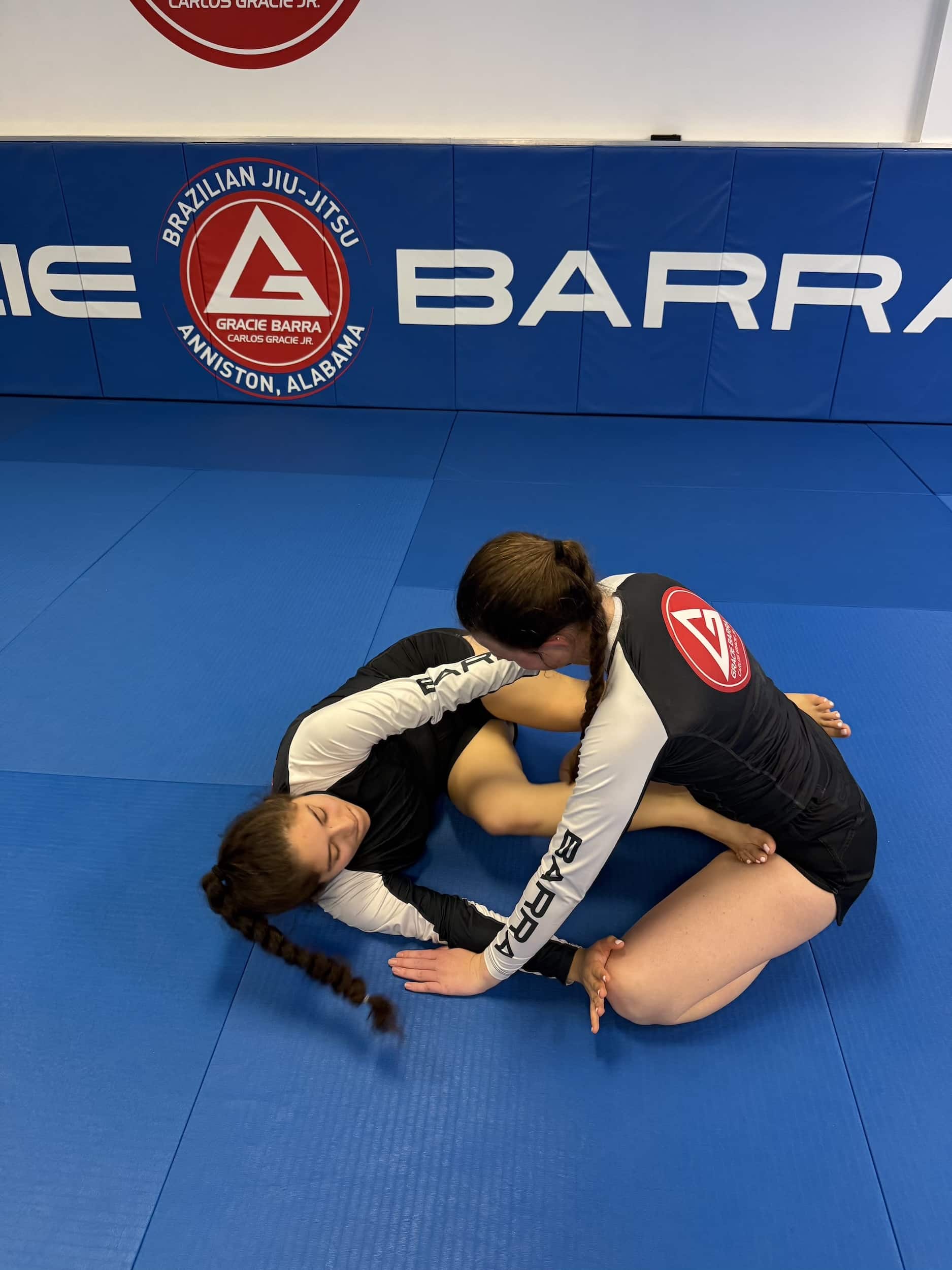 two Gracie Barra Anniston female students sparring during women's only bjj class